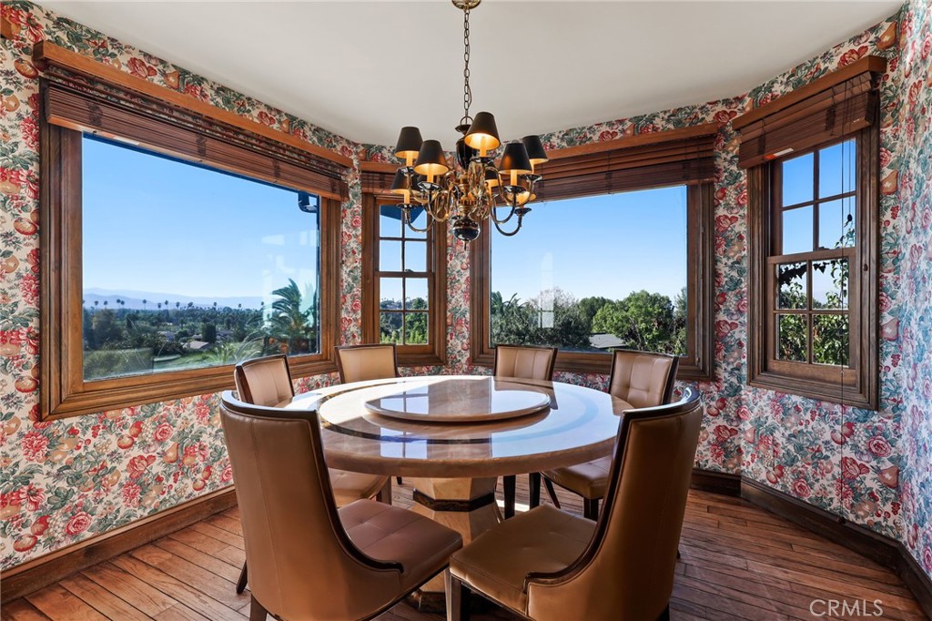 7008 Hawarden Drive Riverside, CA 92506 - Photo 19 of 37 a view of a dining room with furniture window and wooden floor