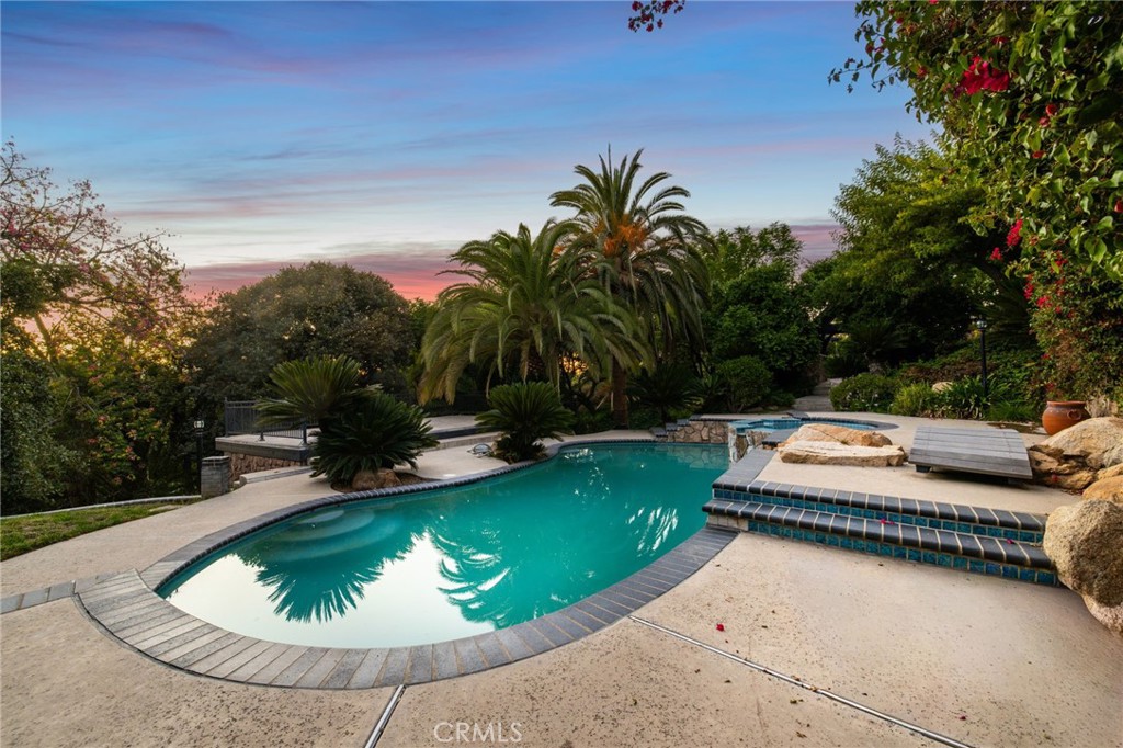 7008 Hawarden Drive Riverside, CA 92506 - Photo 9 of 37 swimming pool view with a garden space