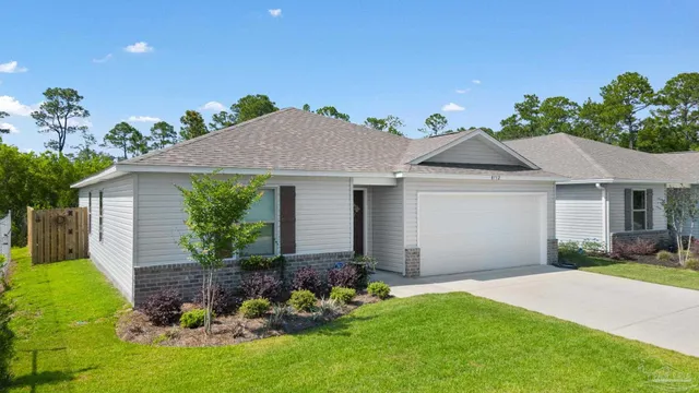 a view of a house with pool and a yard