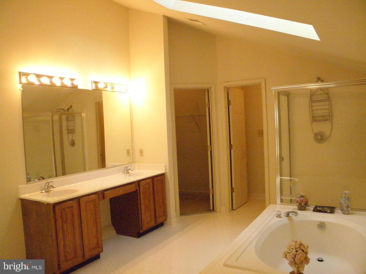 1900 Westchester Drive Silver Spring, MD 20902 - Photo 14 of 21 a bathroom with a tub sink and mirror