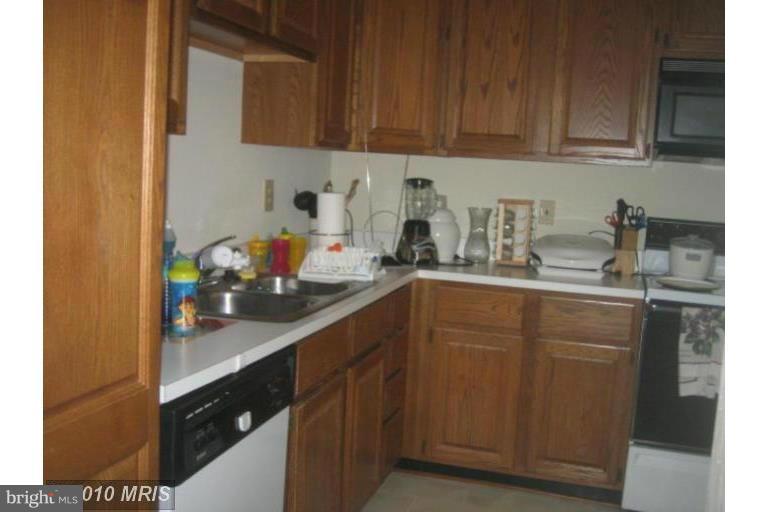 1900 Westchester Drive Silver Spring, MD 20902 - Photo 5 of 21 a kitchen with a sink and cabinets