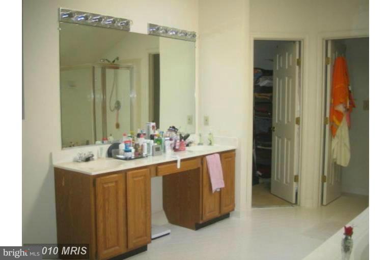 1900 Westchester Drive Silver Spring, MD 20902 - Photo 7 of 21 a bathroom with a sink vanity and a mirror