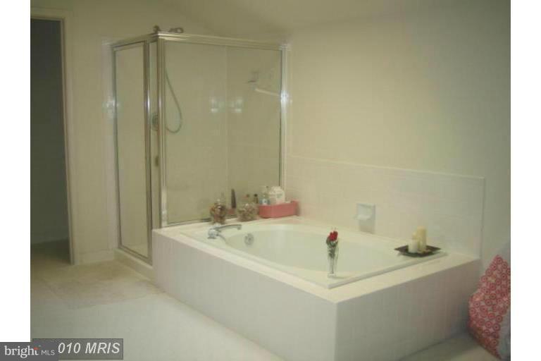 1900 Westchester Drive Silver Spring, MD 20902 - Photo 9 of 21 a white bath tub sitting next to a white sink