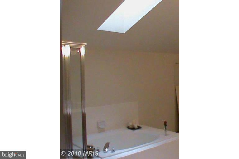 1900 Westchester Drive Silver Spring, MD 20902 - Photo 10 of 21 a bathroom with a tub and a sink