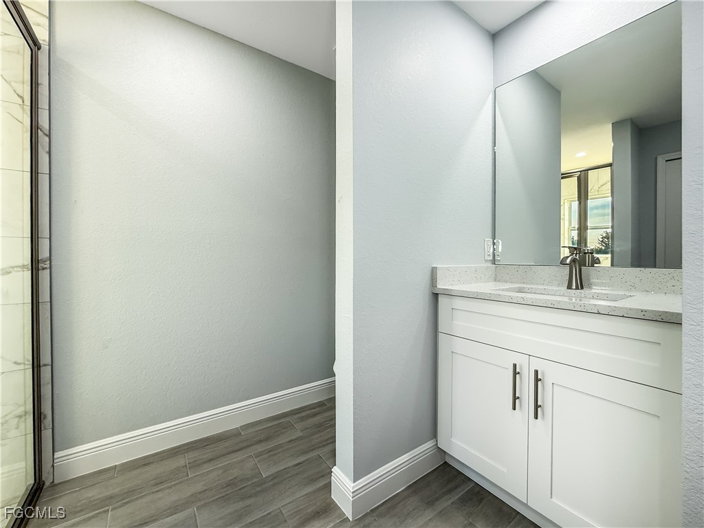 2955 Dunbar Street, Unit A B Fort Myers, FL 33916 - Photo 19 of 19 a bathroom with a sink and a mirror