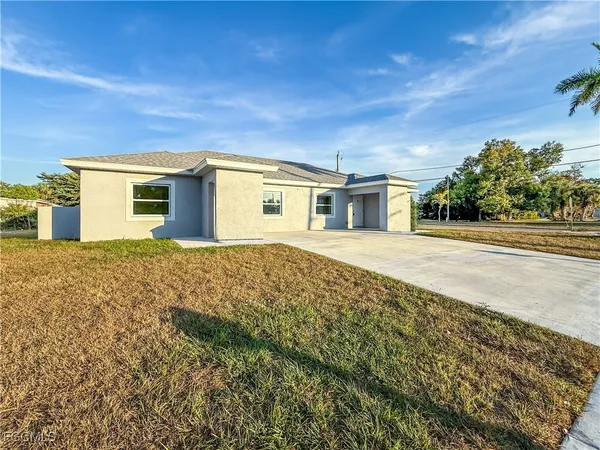 front view of a house with a yard