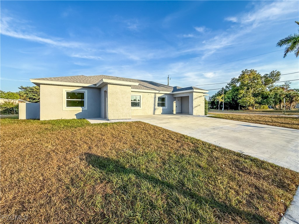 2955 Dunbar Street, Unit A B Fort Myers, FL 33916 - Photo 2 of 19 front view of a house with a yard