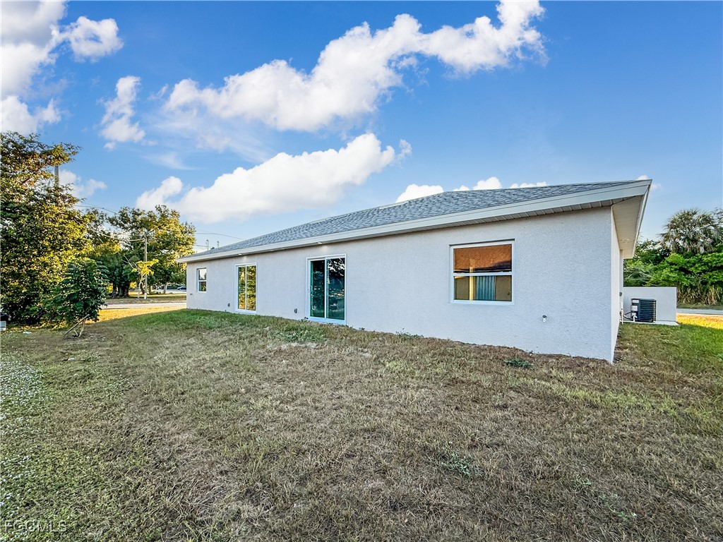 2955 Dunbar Street, Unit A B Fort Myers, FL 33916 - Photo 5 of 19 a view of a house with a backyard
