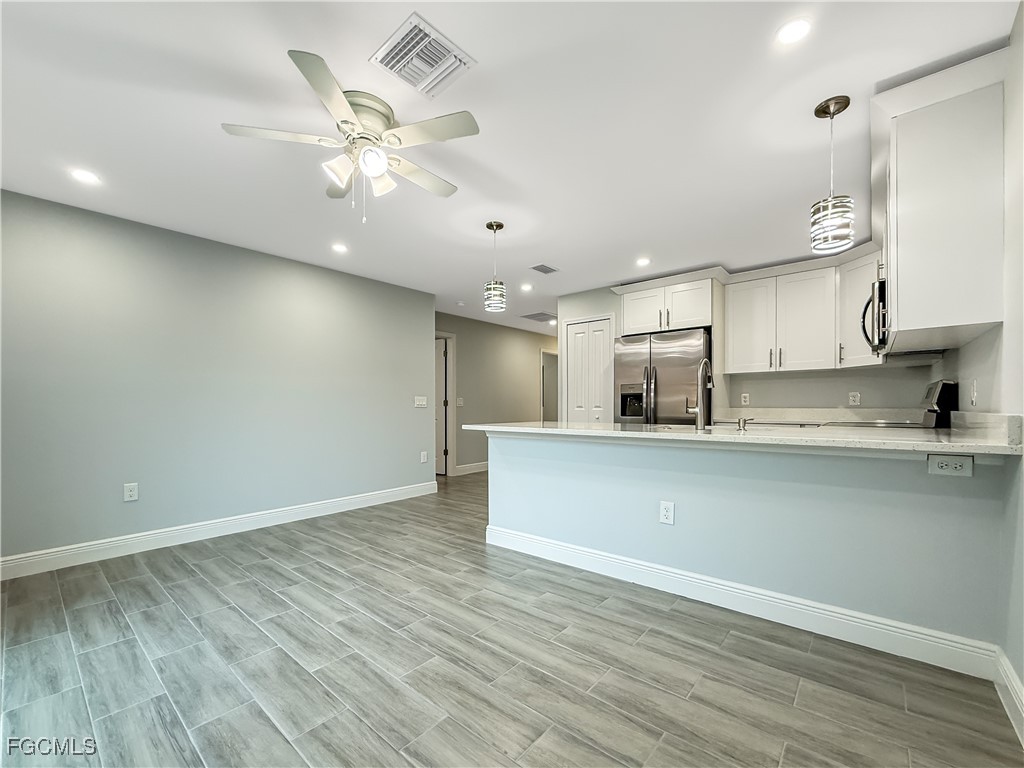 2955 Dunbar Street, Unit A B Fort Myers, FL 33916 - Photo 10 of 19 a view of kitchen with window and wooden floor