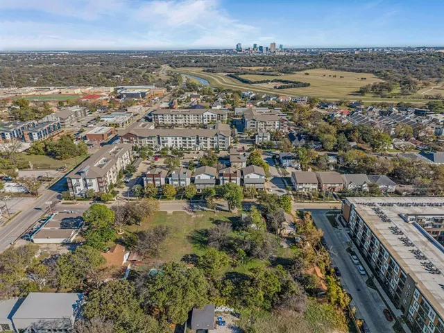 an aerial view of residential building and parking space