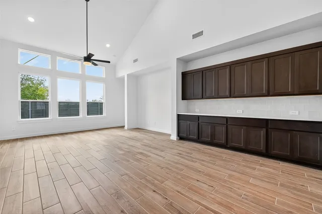 a kitchen with stainless steel appliances a sink stove and cabinets