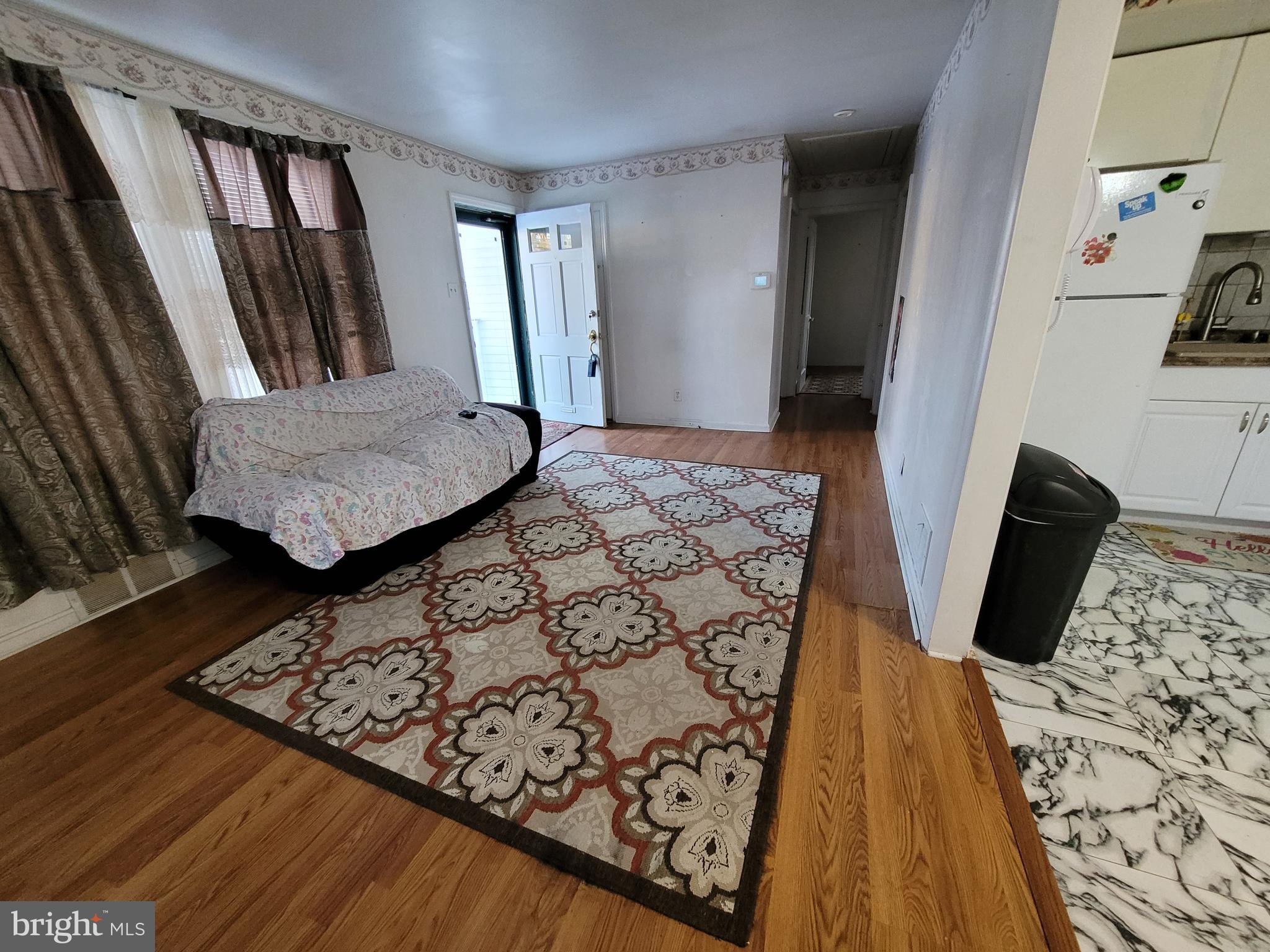 15 Shepherd Road Cherry Hill, NJ 08034 - Photo 6 of 21 a view of a hallway with wooden floor and glass windows