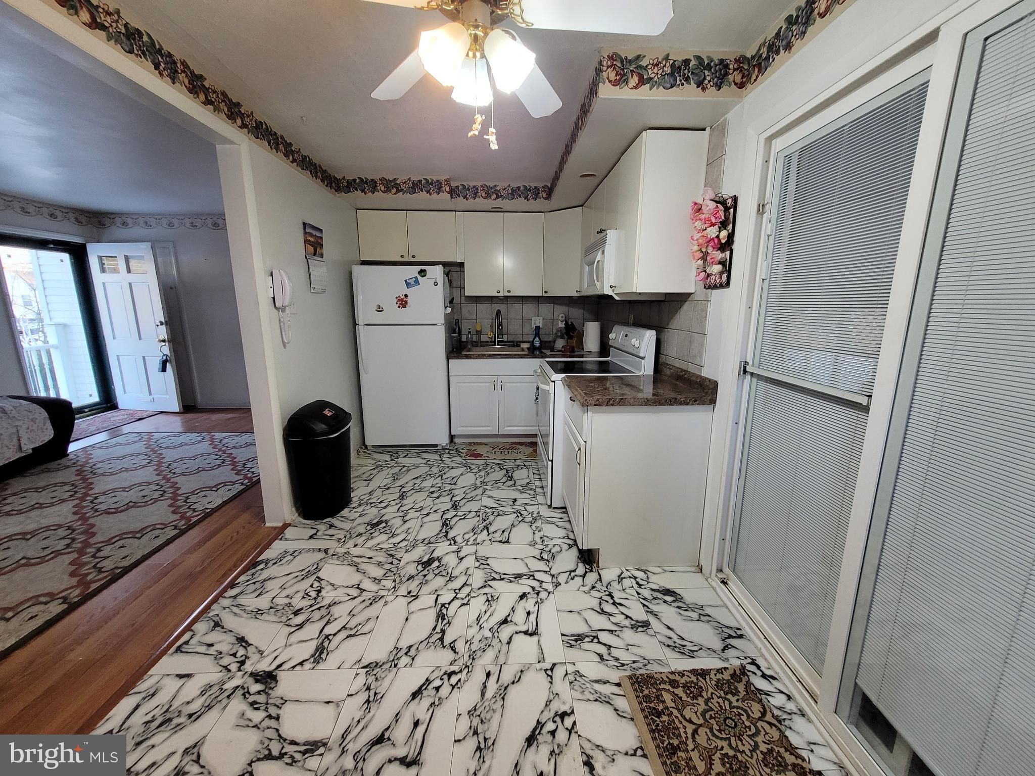15 Shepherd Road Cherry Hill, NJ 08034 - Photo 8 of 21 a kitchen with a refrigerator and a stove top oven