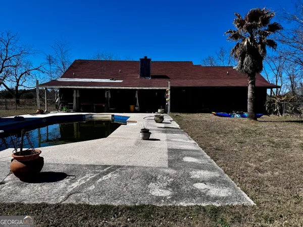 a view of the house with swimming pool