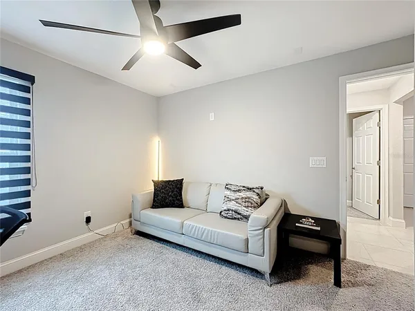 a living room with furniture and a window