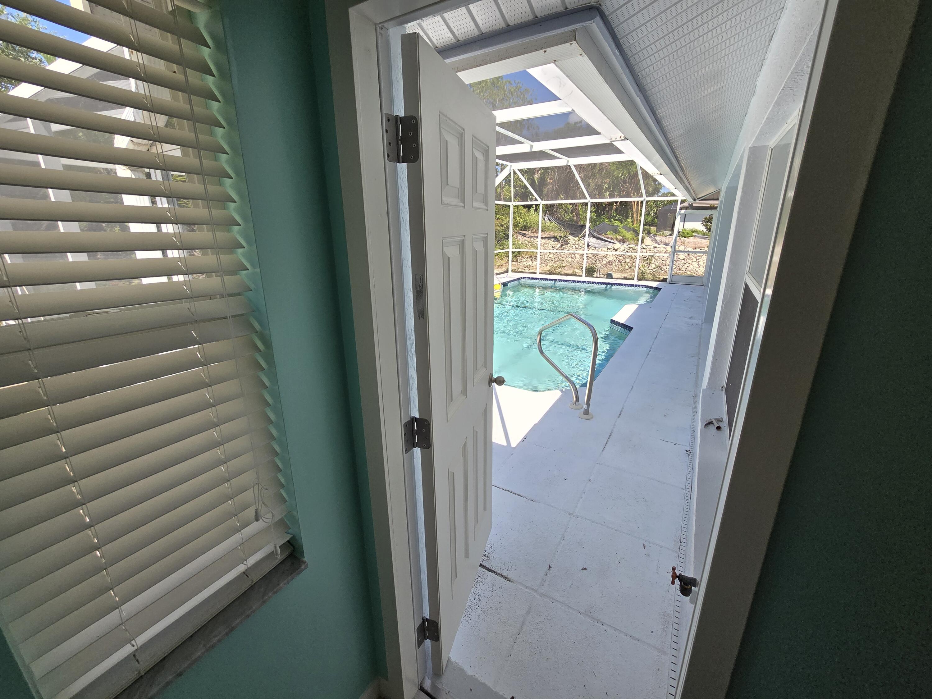 2049 San Marco Road Marco Island, FL 34145 - Photo 63 of 71 Main Bath Door to Pool