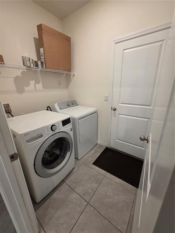 8059 Southwest 57th Court Ocala, FL 34476 - Photo 16 of 36 a utility room with dryer and washer