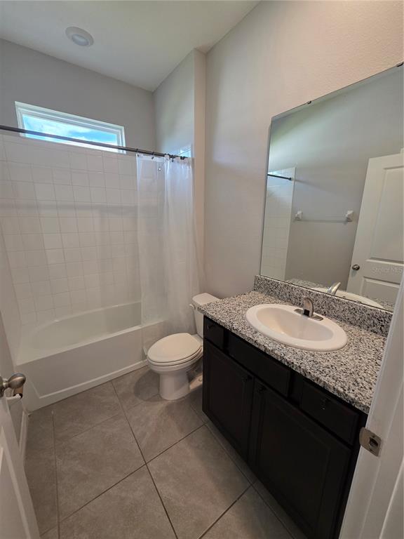 8059 Southwest 57th Court Ocala, FL 34476 - Photo 8 of 36 a bathroom with a granite countertop sink toilet and shower