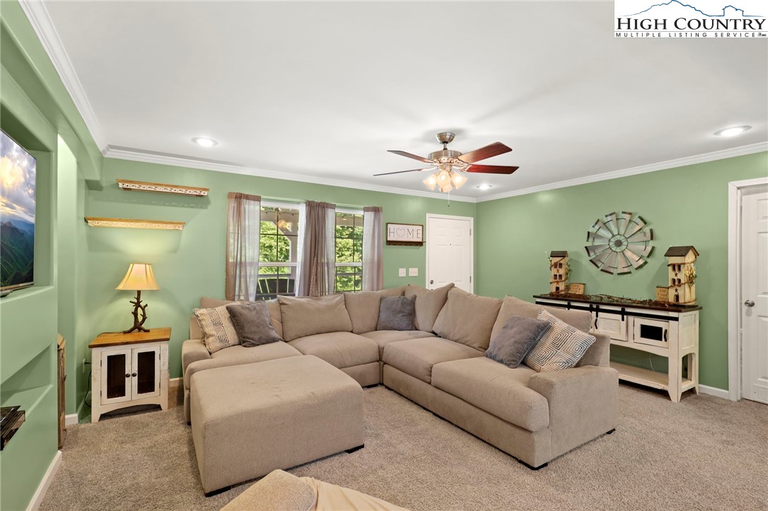 565 Valley Road Spruce Pine, NC 28777 - Photo 11 of 39 a living room with furniture and a large window
