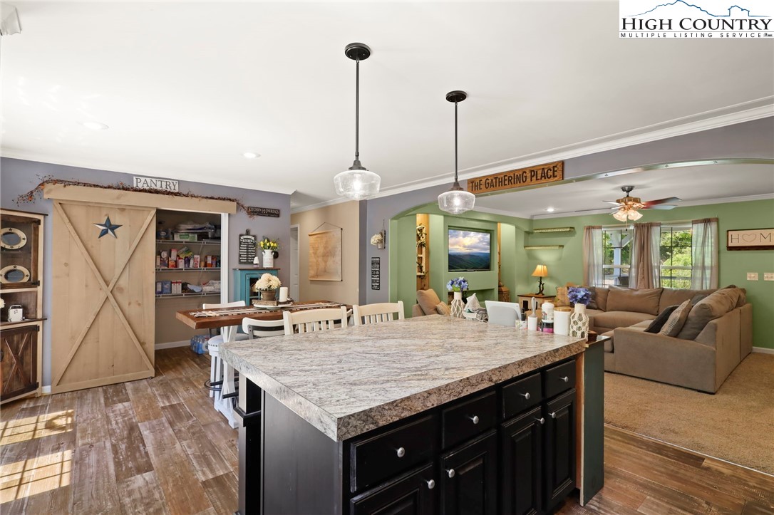 565 Valley Road Spruce Pine, NC 28777 - Photo 16 of 39 a view of a living room and kitchen