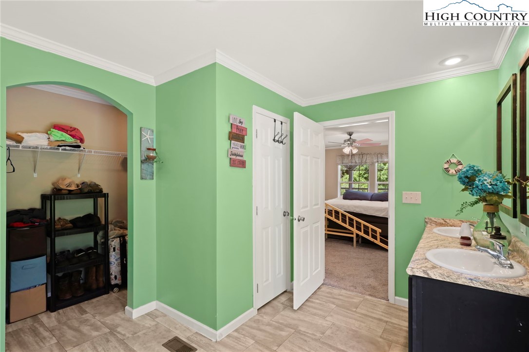 565 Valley Road Spruce Pine, NC 28777 - Photo 24 of 39 a living room with furniture and a potted plant