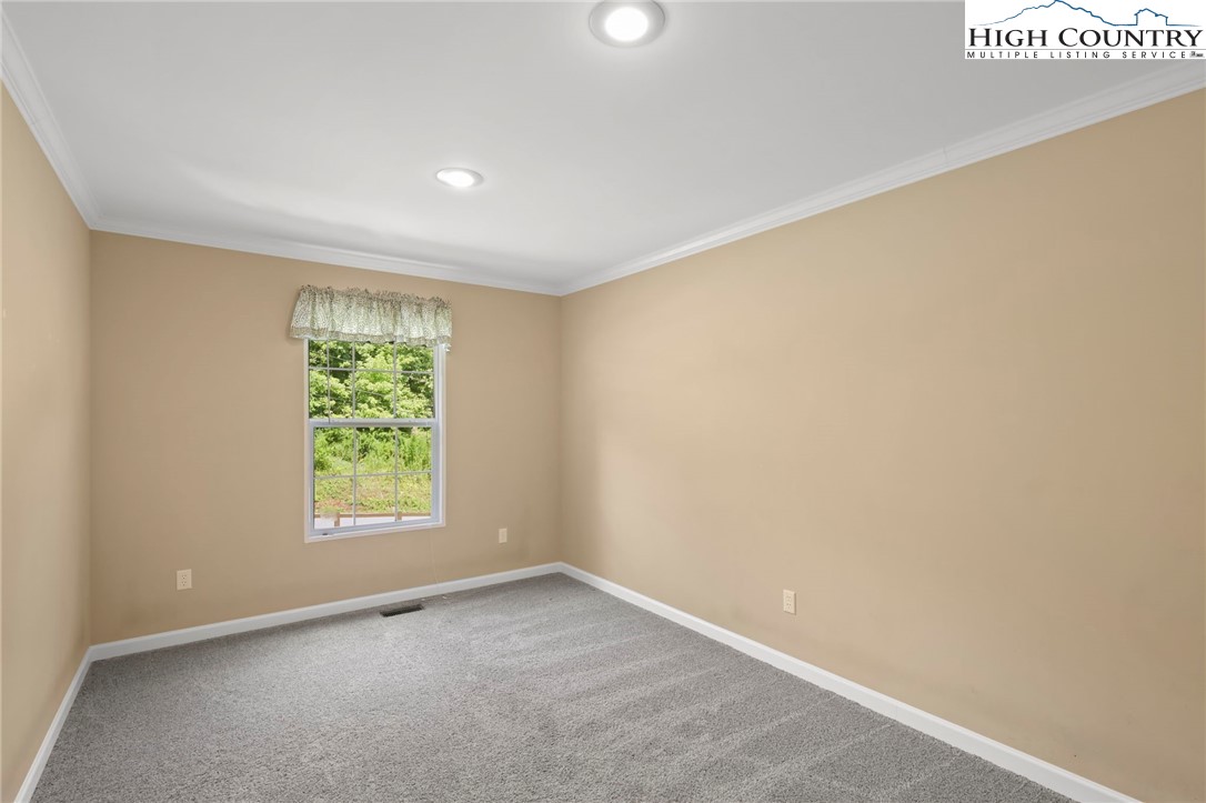 565 Valley Road Spruce Pine, NC 28777 - Photo 27 of 39 an empty room with a window