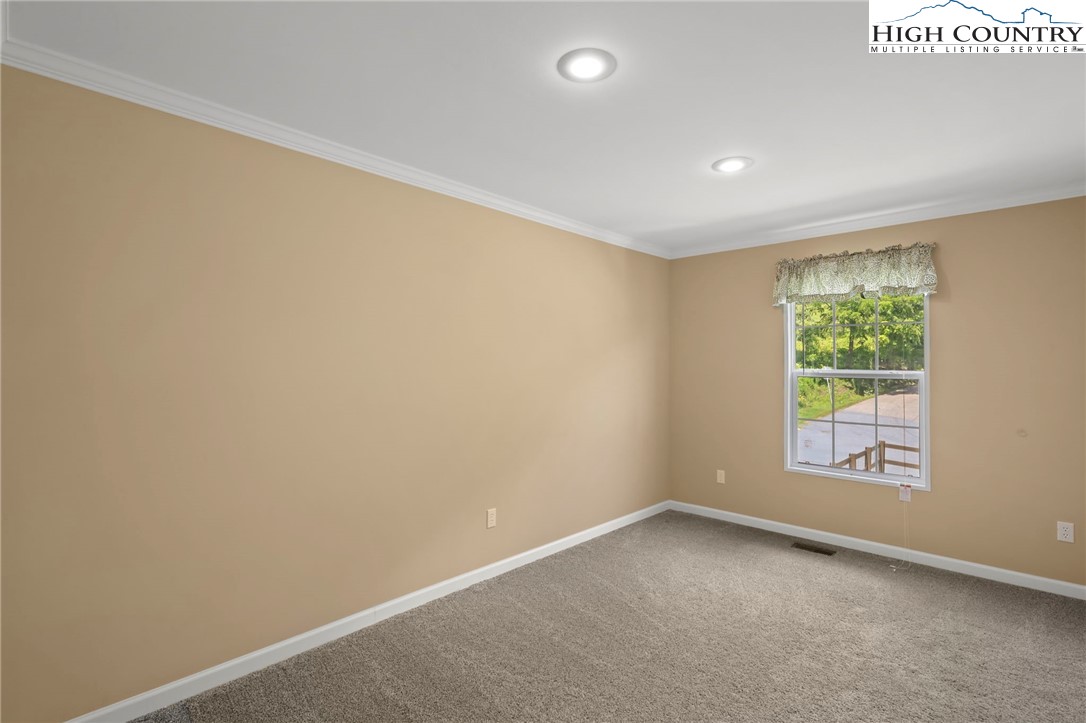 565 Valley Road Spruce Pine, NC 28777 - Photo 30 of 39 an empty room with windows