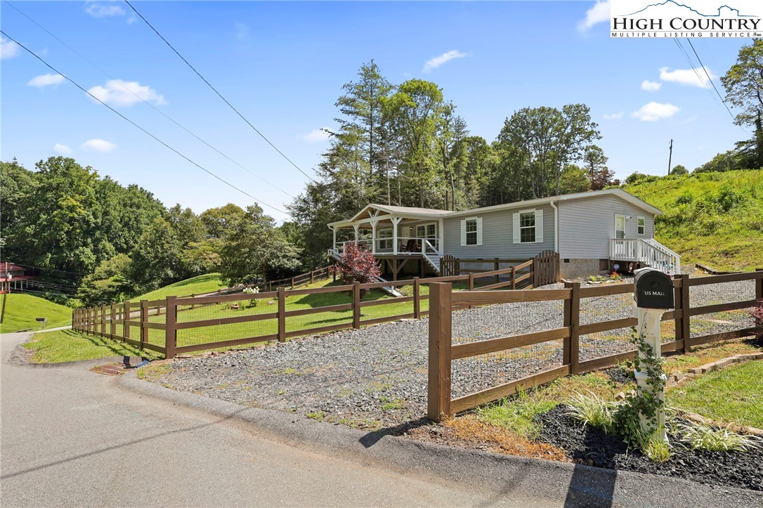 565 Valley Road Spruce Pine, NC 28777 - Photo 3 of 39 a view of a terrace with chairs
