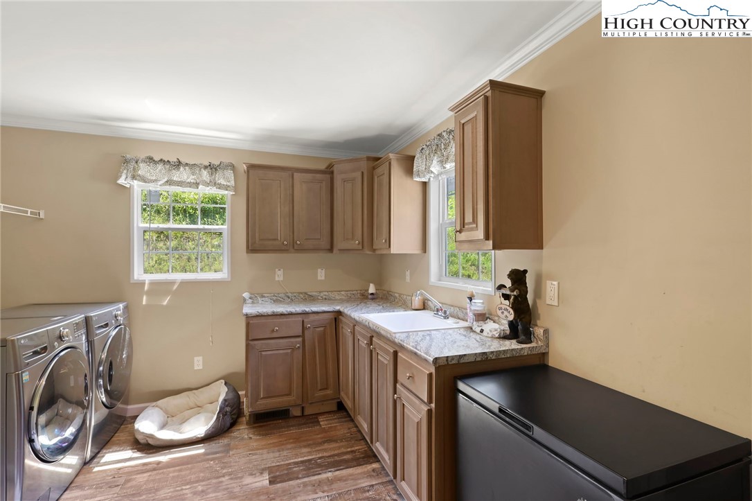 565 Valley Road Spruce Pine, NC 28777 - Photo 32 of 39 a kitchen with a sink cabinets and a window