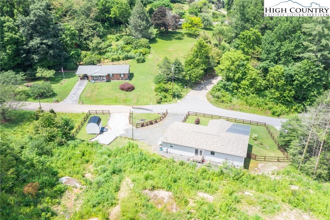 565 Valley Road Spruce Pine, NC 28777 - Photo 38 of 39 an aerial view of a house having yard