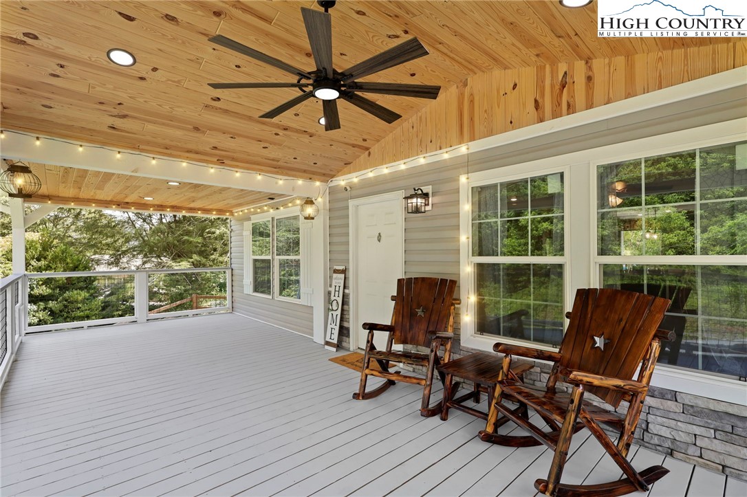 565 Valley Road Spruce Pine, NC 28777 - Photo 8 of 39 a view of a patio with table and chairs