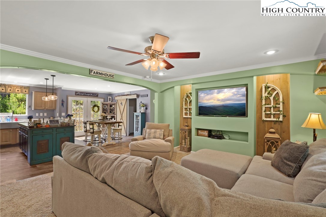 565 Valley Road Spruce Pine, NC 28777 - Photo 9 of 39 a living room with furniture and a flat screen tv
