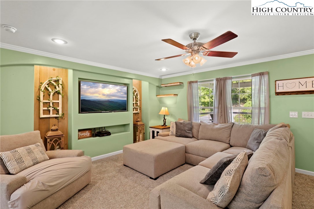 565 Valley Road Spruce Pine, NC 28777 - Photo 10 of 39 a living room with furniture and a large window