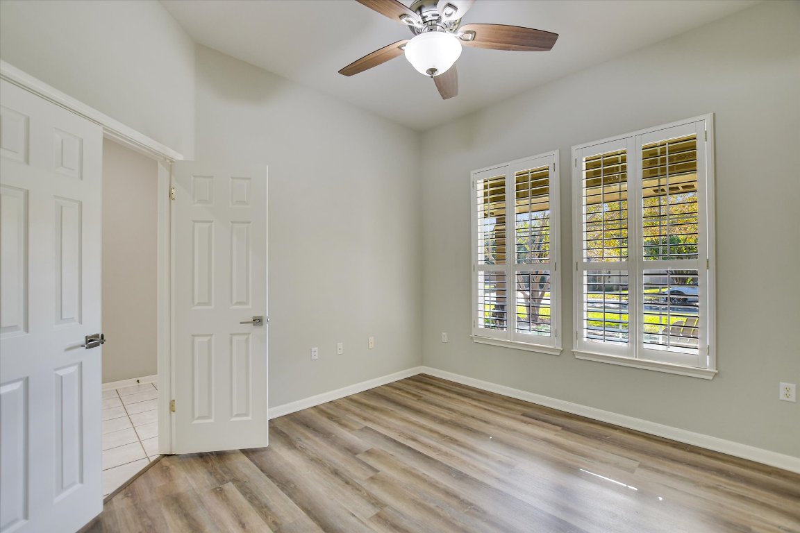 126 Bass Street Georgetown, TX 78633 - Photo 12 of 20 Spare room with light wood-type flooring and ceiling fan