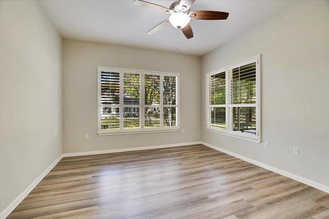 126 Bass Street Georgetown, TX 78633 - Photo 13 of 20 Spare room with plenty of natural light, light wood finished floors, and ceiling fan