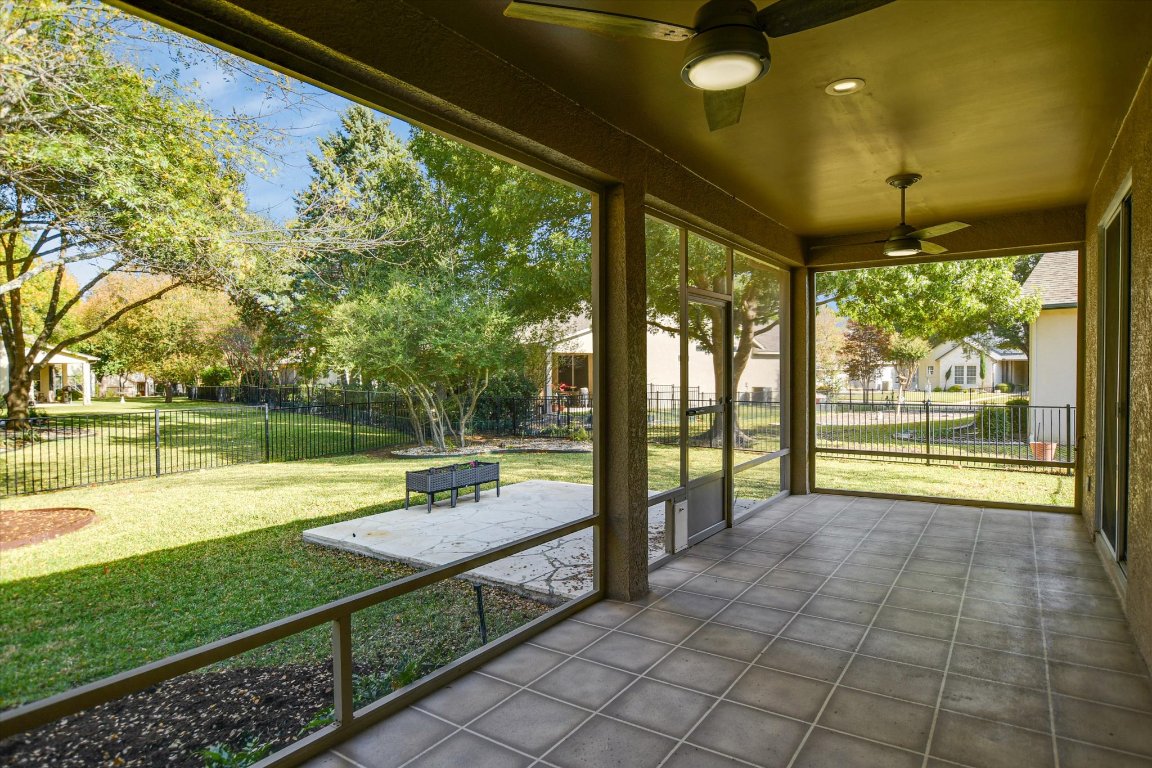 126 Bass Street Georgetown, TX 78633 - Photo 18 of 20 Unfurnished sunroom featuring a ceiling fan and a residential view
