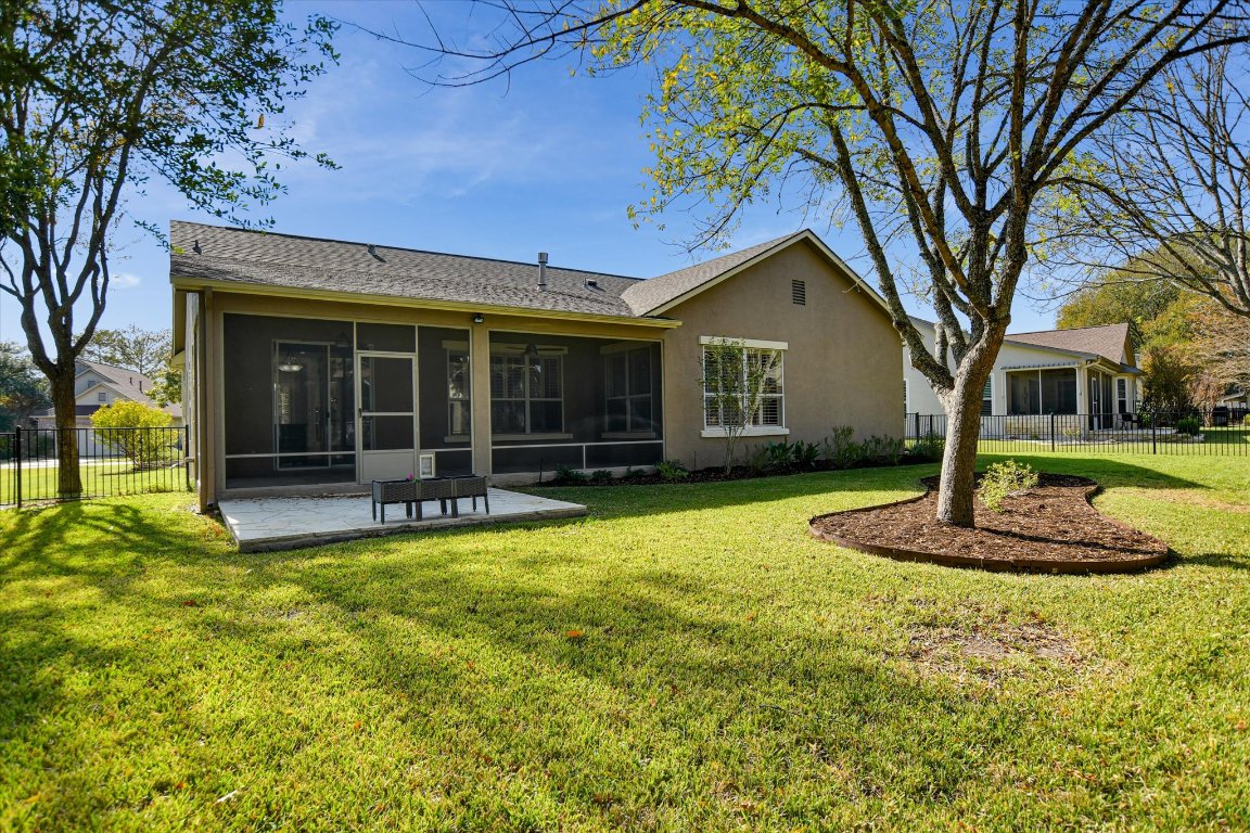 126 Bass Street Georgetown, TX 78633 - Photo 19 of 20 Rear view of property featuring a sunroom and stucco siding