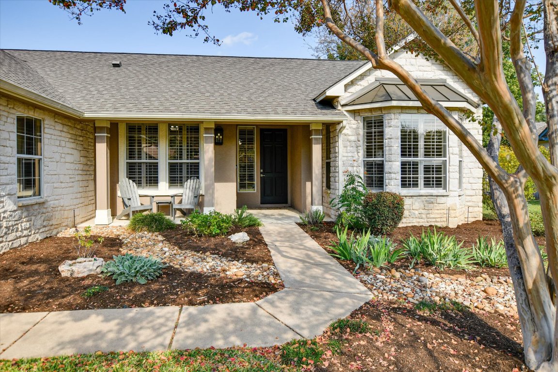 126 Bass Street Georgetown, TX 78633 - Photo 2 of 20 View of front facade featuring stone siding, a shingled roof, a porch, and stucco siding