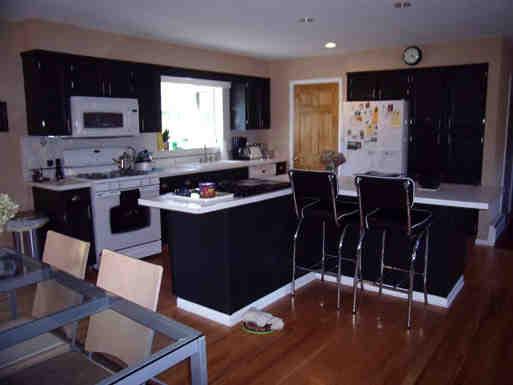 77 Swamp Road West Stockbridge, MA 01266 - Photo 4 of 6 a kitchen with stainless steel appliances granite countertop a stove a sink a microwave refrigerator and chairs