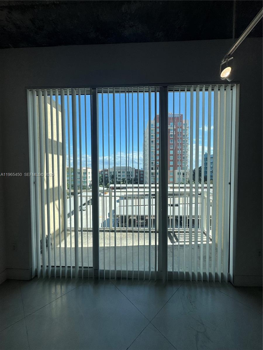 2001 Biscayne Boulevard, Unit 2621 Miami, FL 33137 - Photo 8 of 23 a view of a room with windows