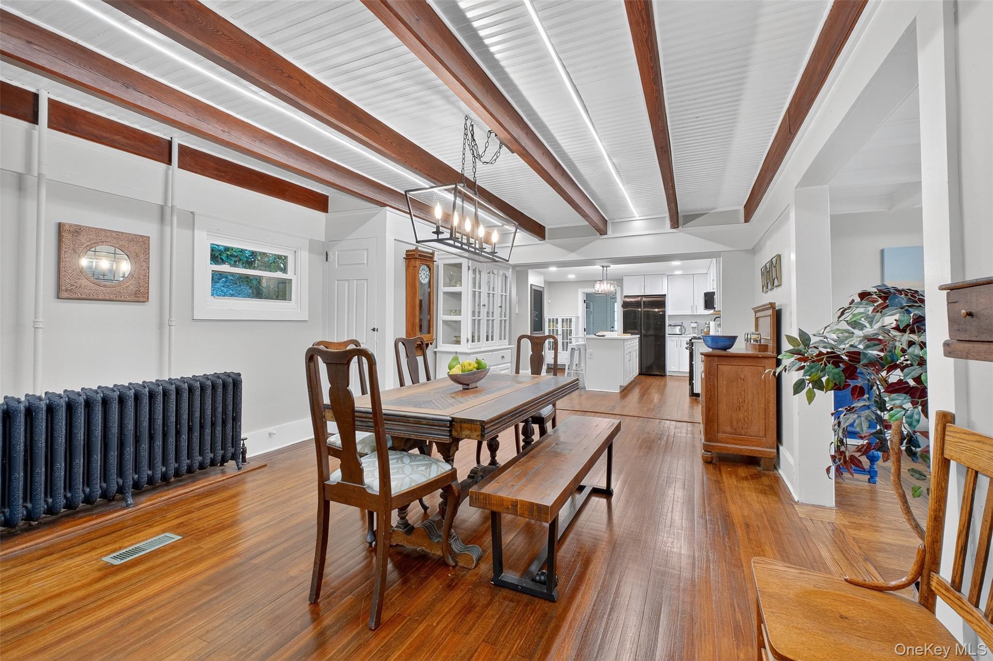 30 Old Post Road North Red Hook, NY 12571 - Photo 12 of 39 Dining space featuring light wood-type flooring, radiator, and beamed ceiling