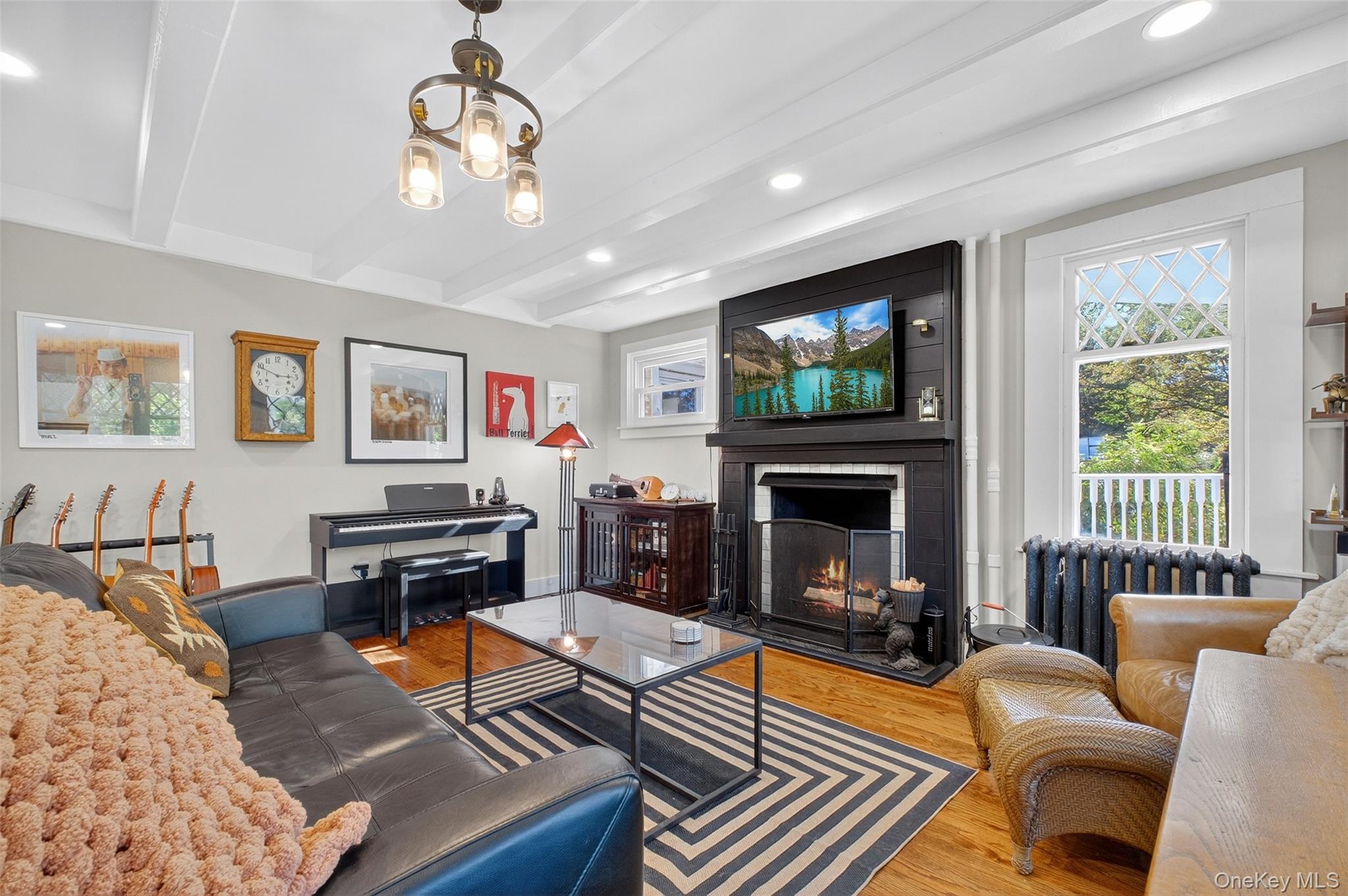 30 Old Post Road North Red Hook, NY 12571 - Photo 16 of 39 a living room with furniture a flat screen tv and a fireplace