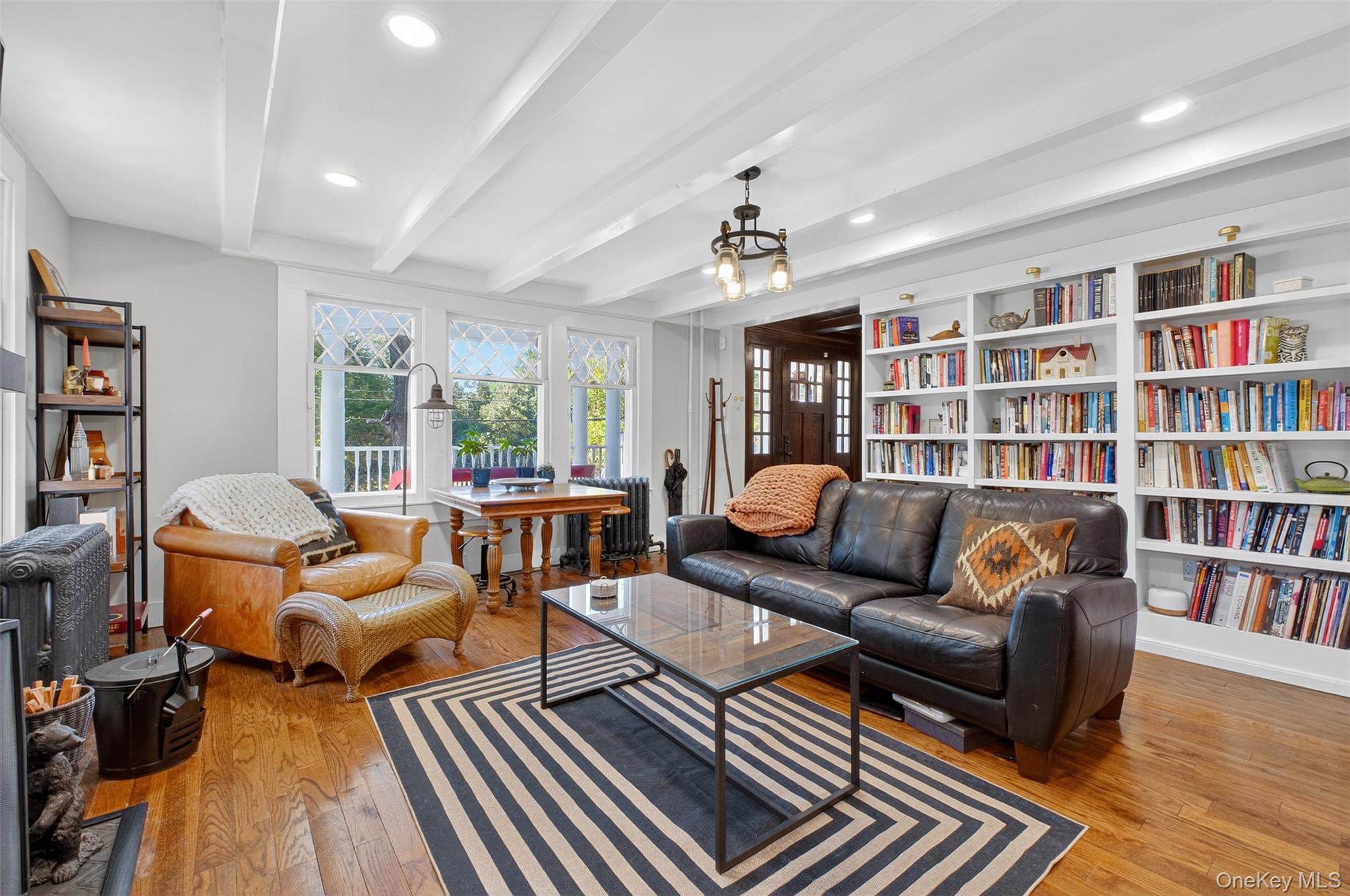 30 Old Post Road North Red Hook, NY 12571 - Photo 18 of 39 a living room with furniture and a book shelf
