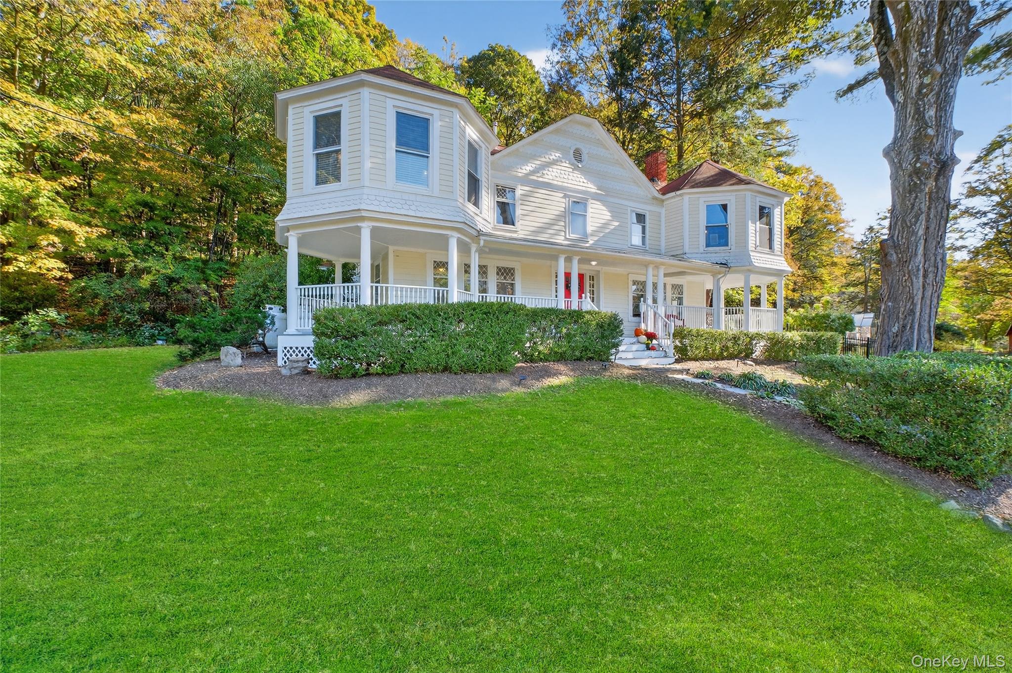 30 Old Post Road North Red Hook, NY 12571 - Photo 2 of 39 a front view of a house with a garden and plants