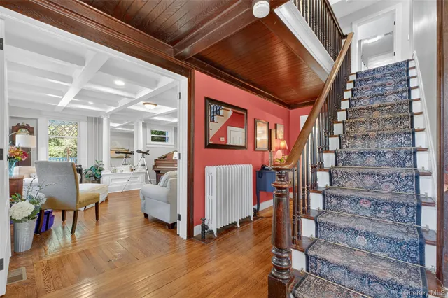 a view of entryway with livingroom and wooden floor