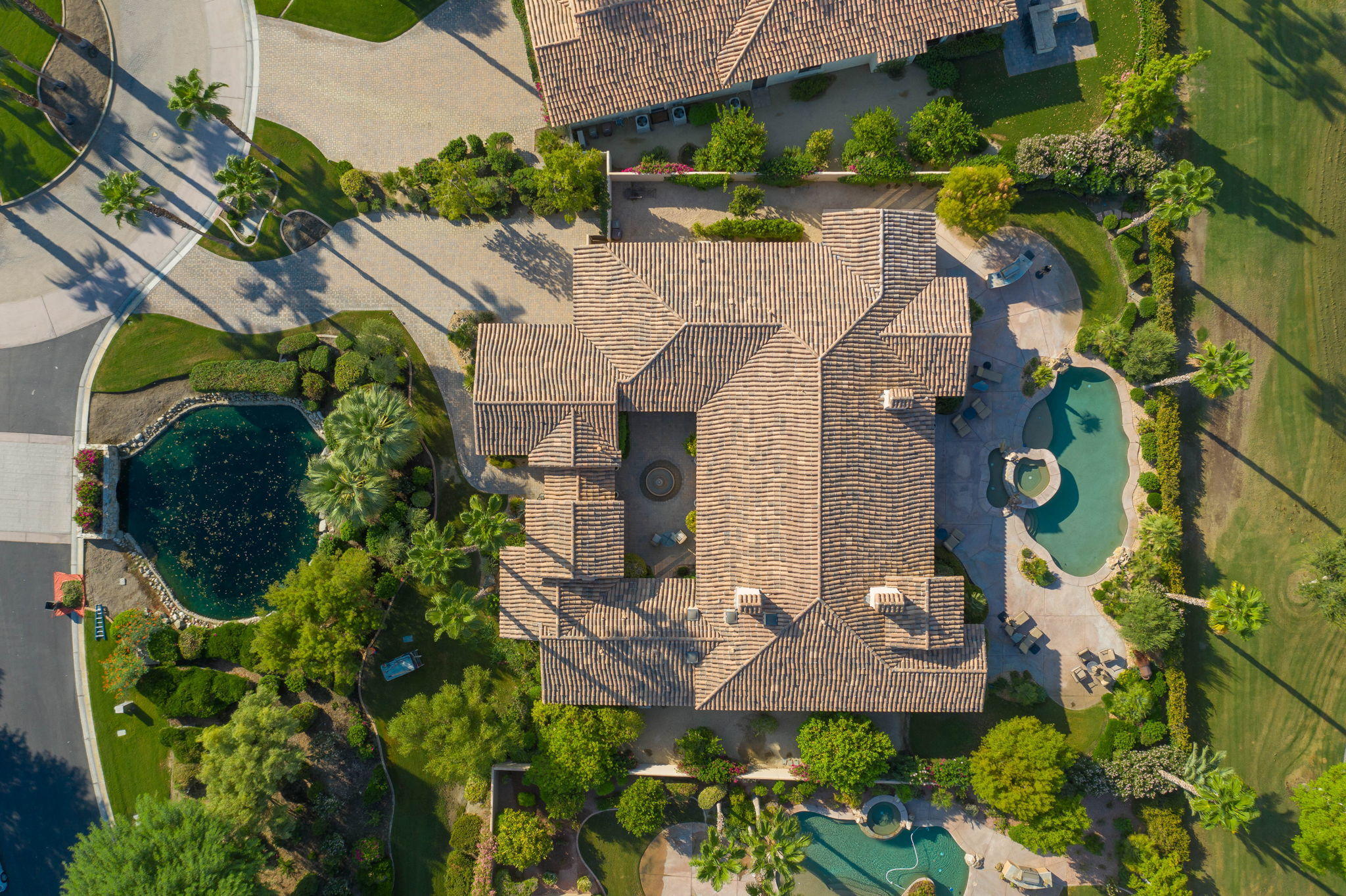 57325 Peninsula Lane La Quinta, CA 92253 - Photo 11 of 66 an aerial view of a house with a yard basket ball court and outdoor seating