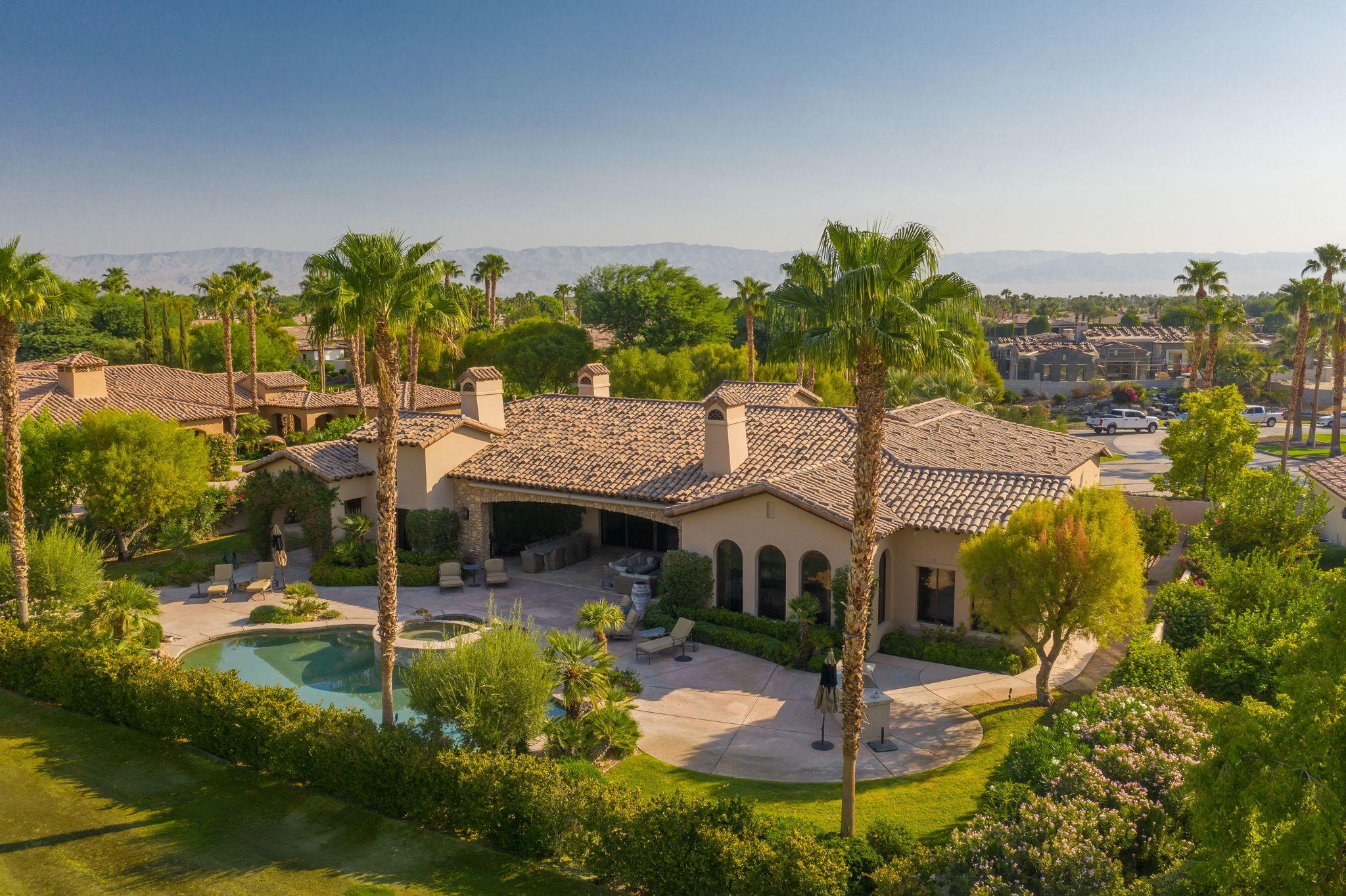 57325 Peninsula Lane La Quinta, CA 92253 - Photo 12 of 66 a front view of a house with garden