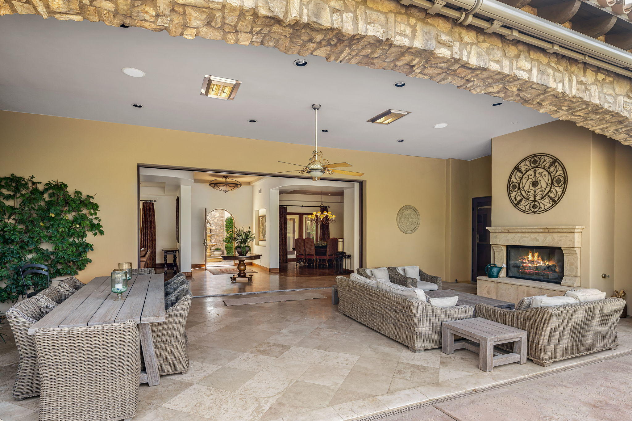 57325 Peninsula Lane La Quinta, CA 92253 - Photo 23 of 66 a living room with furniture a fireplace and a large window