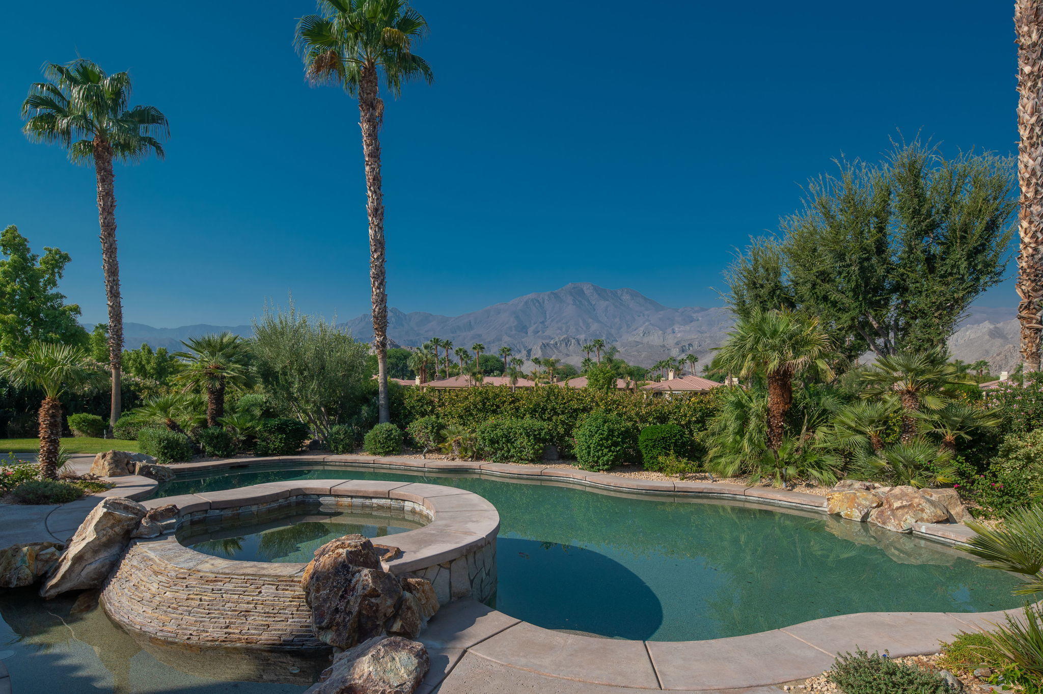 57325 Peninsula Lane La Quinta, CA 92253 - Photo 25 of 66 a view of a swimming pool with a patio
