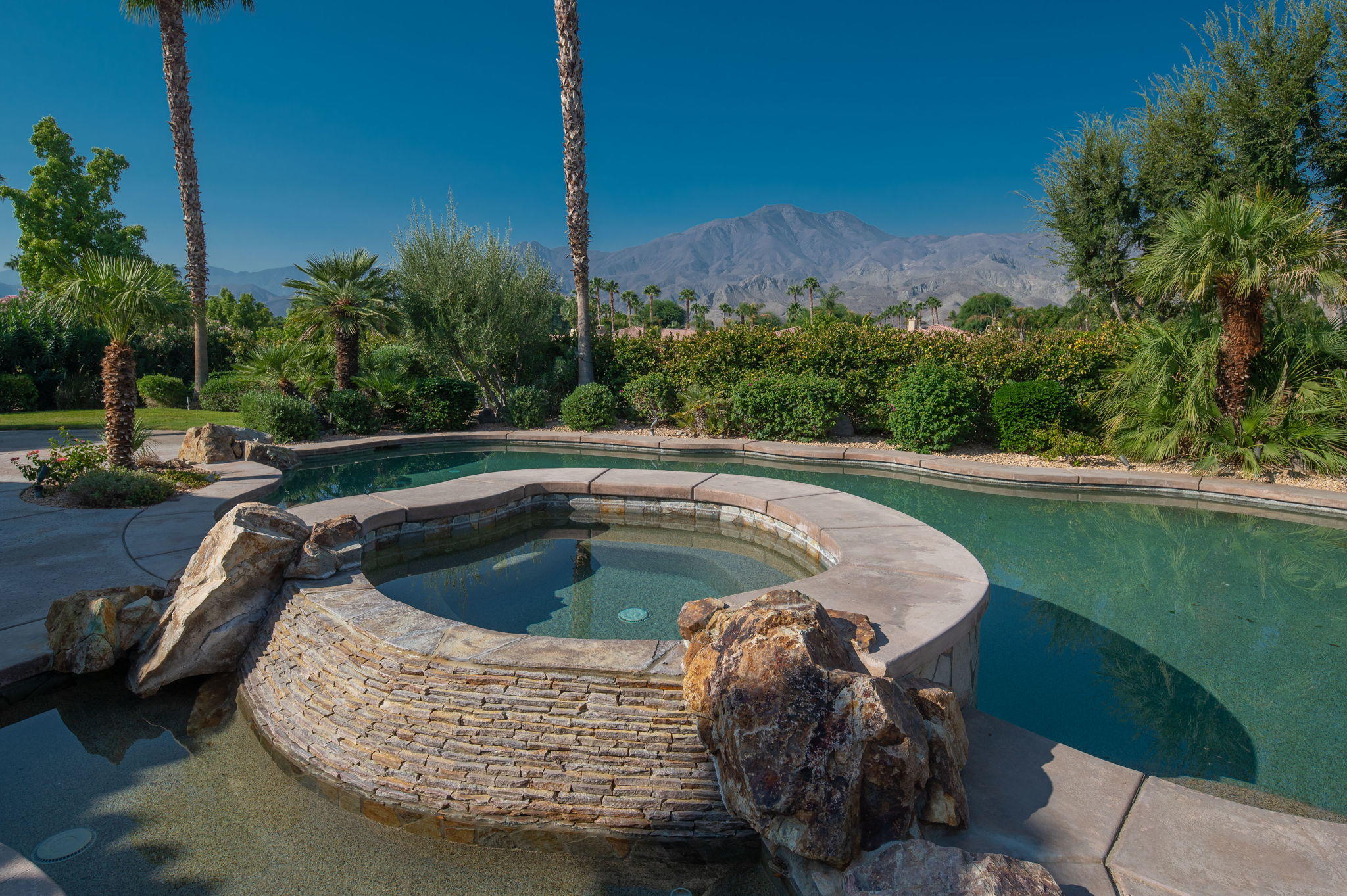 57325 Peninsula Lane La Quinta, CA 92253 - Photo 26 of 66 a view of a swimming pool with a patio